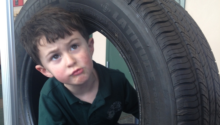 Patrick in tire.JPG